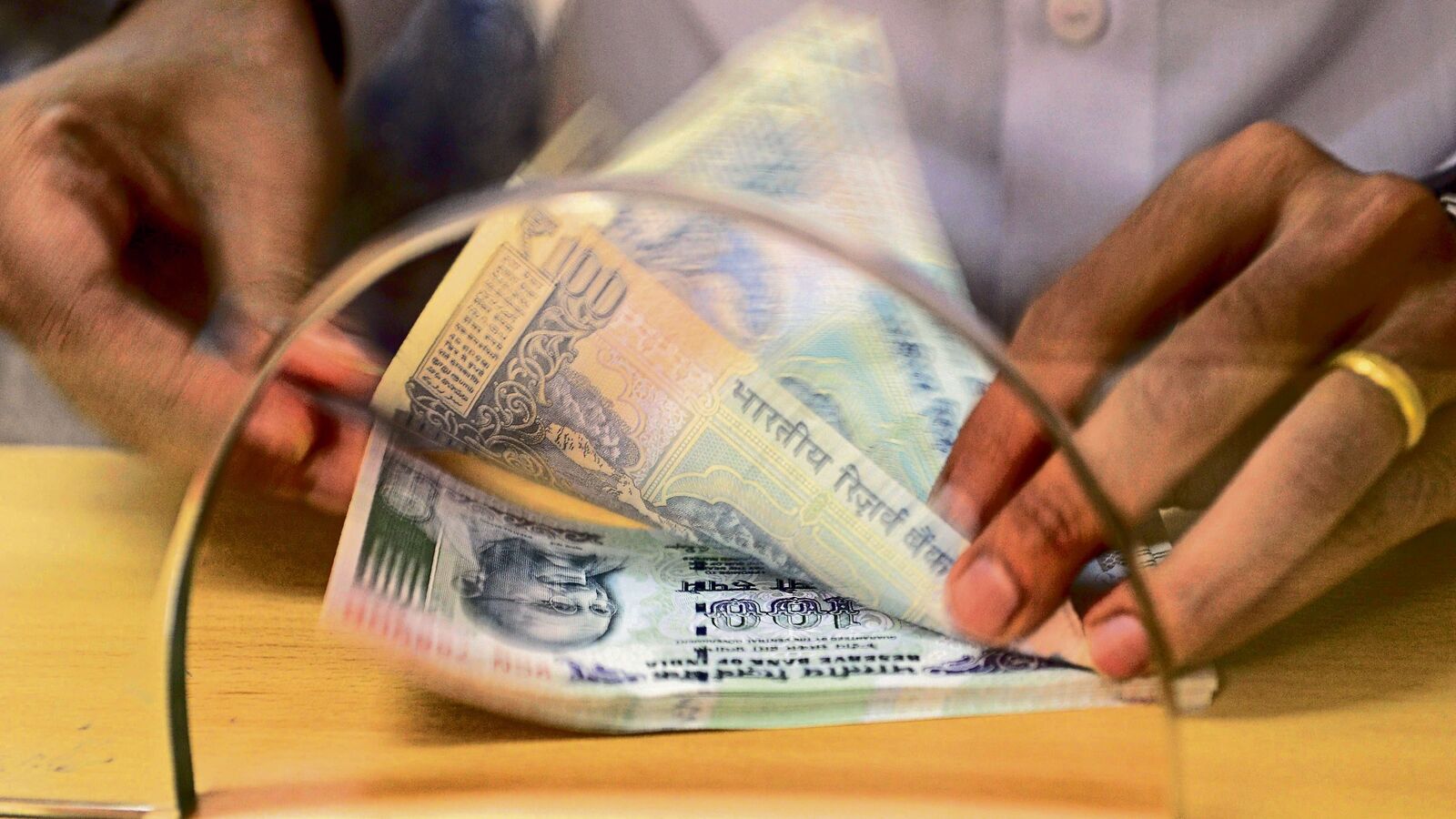 Rupee falls to record low against US dollar; weakens past 83.60/$